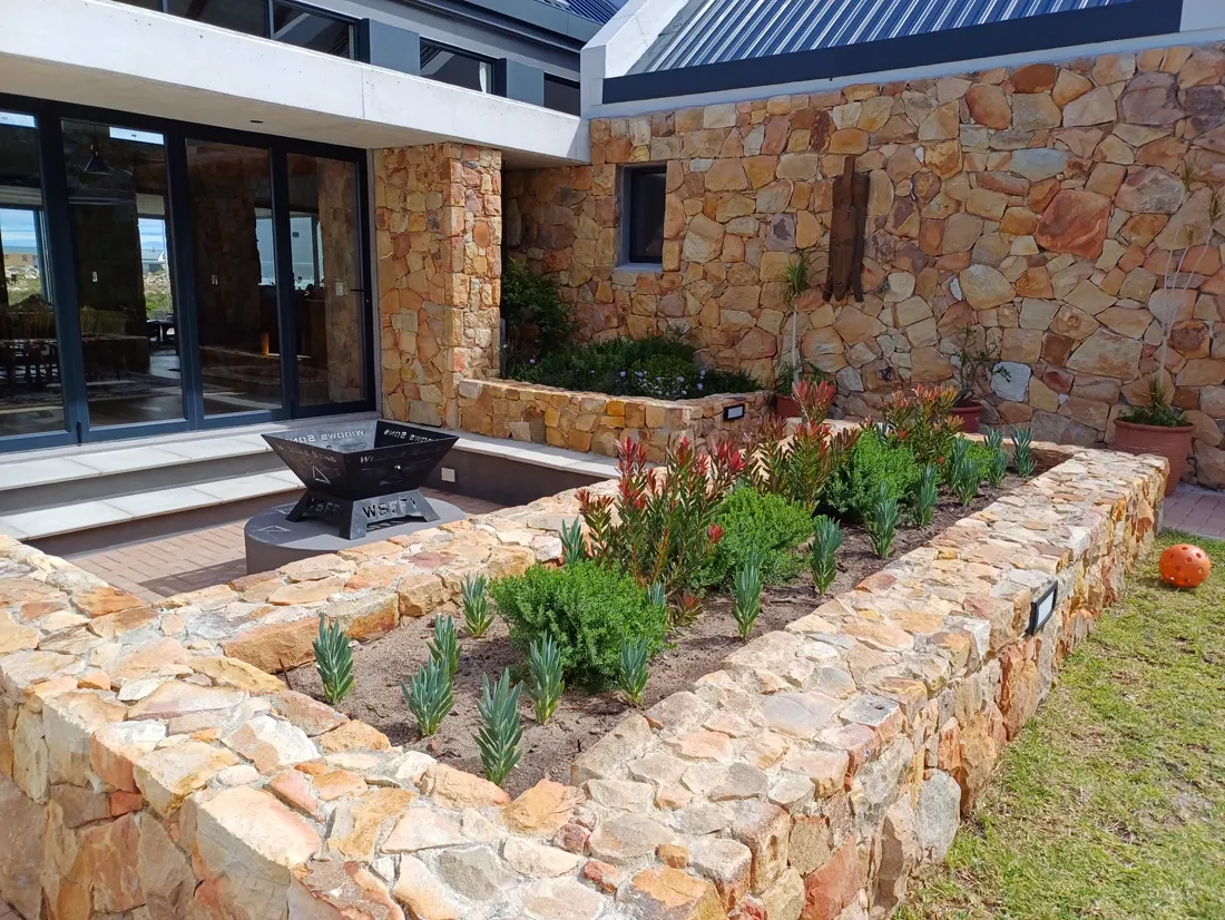 After: Before and after of a stone raised garden bed